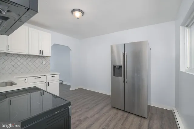 a kitchen with wooden cabinets and a sink