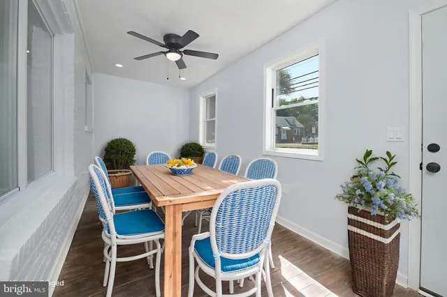a dining room with furniture and window