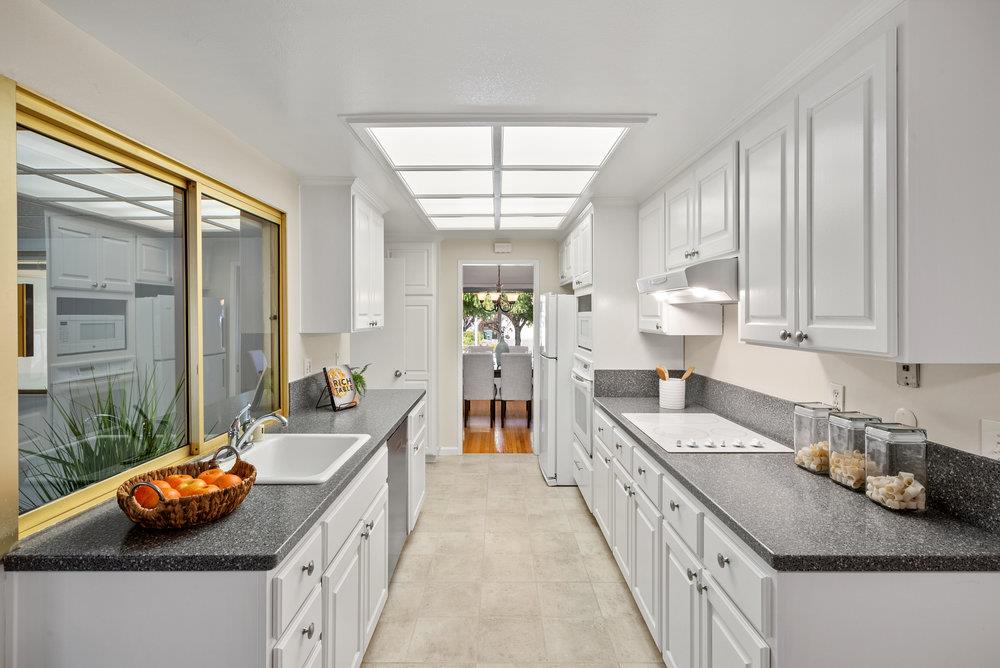 1121 Yorkshire Drive Cupertino, CA 95014 - Photo 13 of 30 a kitchen that has a lot of cabinets