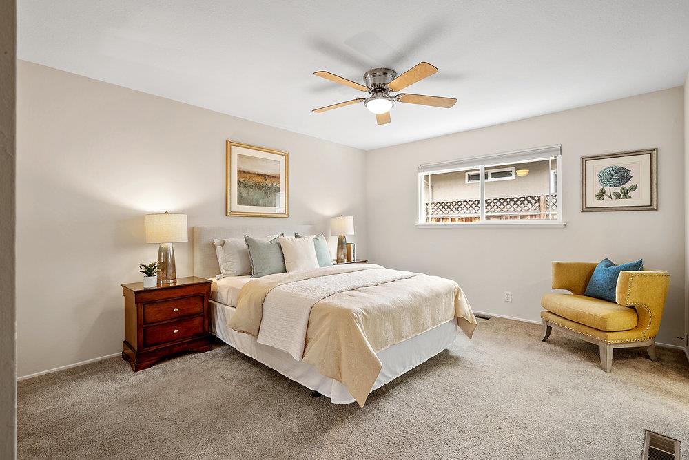 1121 Yorkshire Drive Cupertino, CA 95014 - Photo 15 of 30 a bed room with a bed and a couch