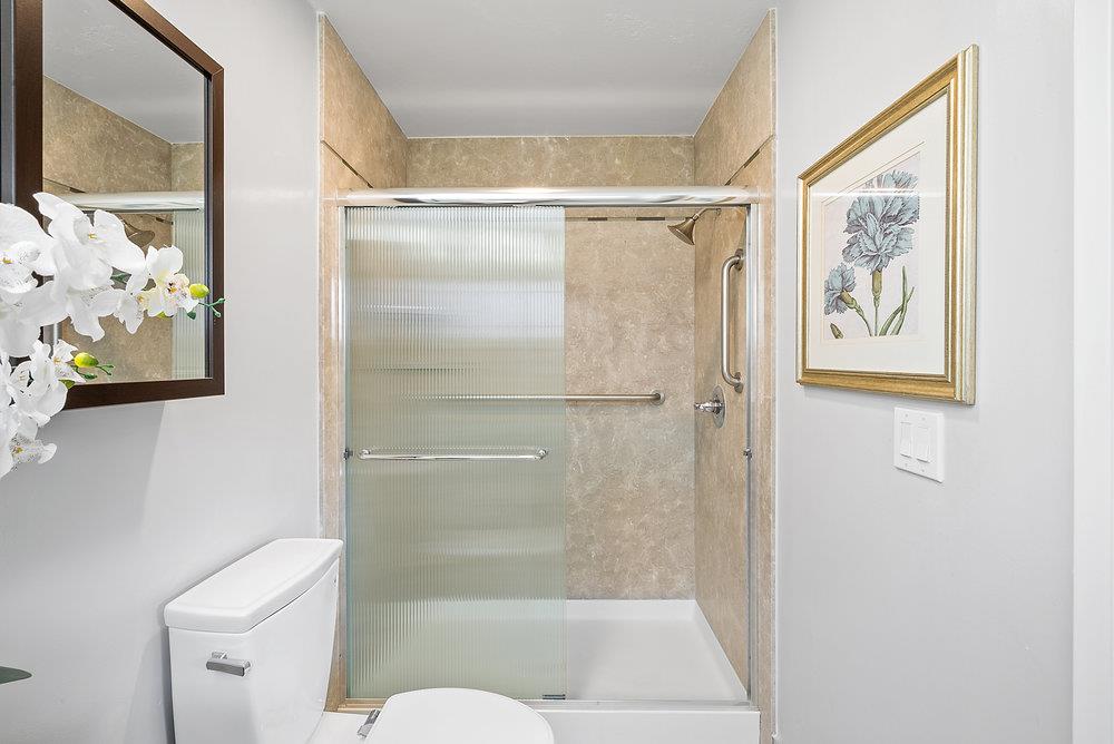 1121 Yorkshire Drive Cupertino, CA 95014 - Photo 19 of 30 a bathroom with a shower and a toilet
