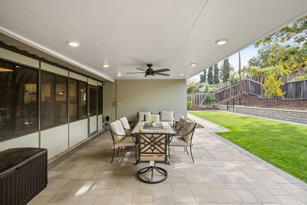 1121 Yorkshire Drive Cupertino, CA 95014 - Photo 22 of 30 a view of a patio with a table and chairs
