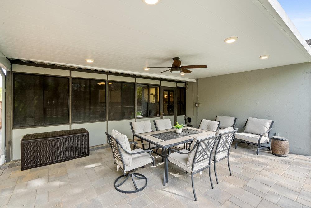 1121 Yorkshire Drive Cupertino, CA 95014 - Photo 23 of 30 a view of a patio with a dining table and chairs