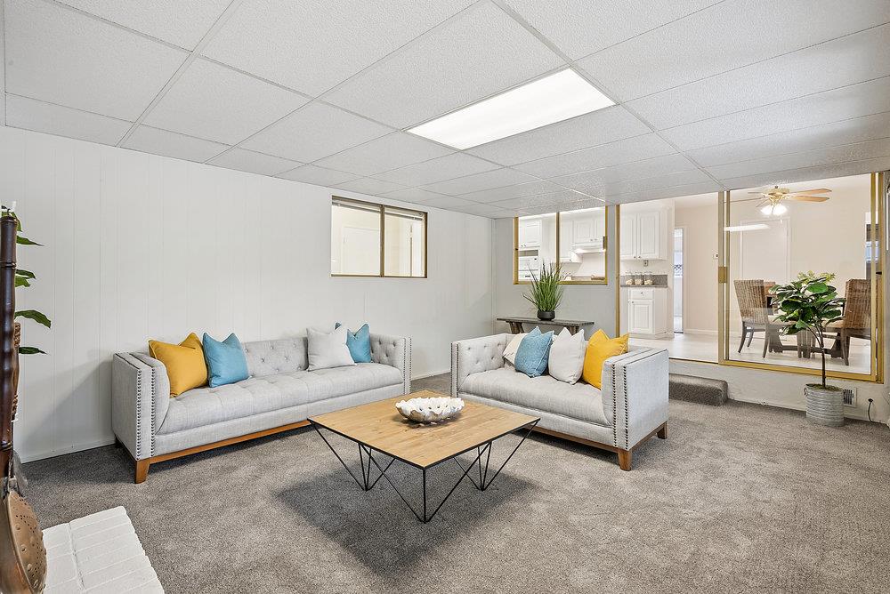 1121 Yorkshire Drive Cupertino, CA 95014 - Photo 7 of 30 a living room with furniture and a large window
