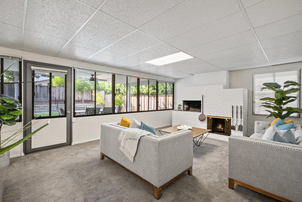 1121 Yorkshire Drive Cupertino, CA 95014 - Photo 8 of 30 a living room with furniture and a fireplace