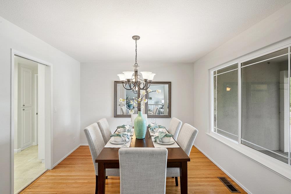 1121 Yorkshire Drive Cupertino, CA 95014 - Photo 10 of 30 a view of a dining room with furniture a chandelier and wooden floor