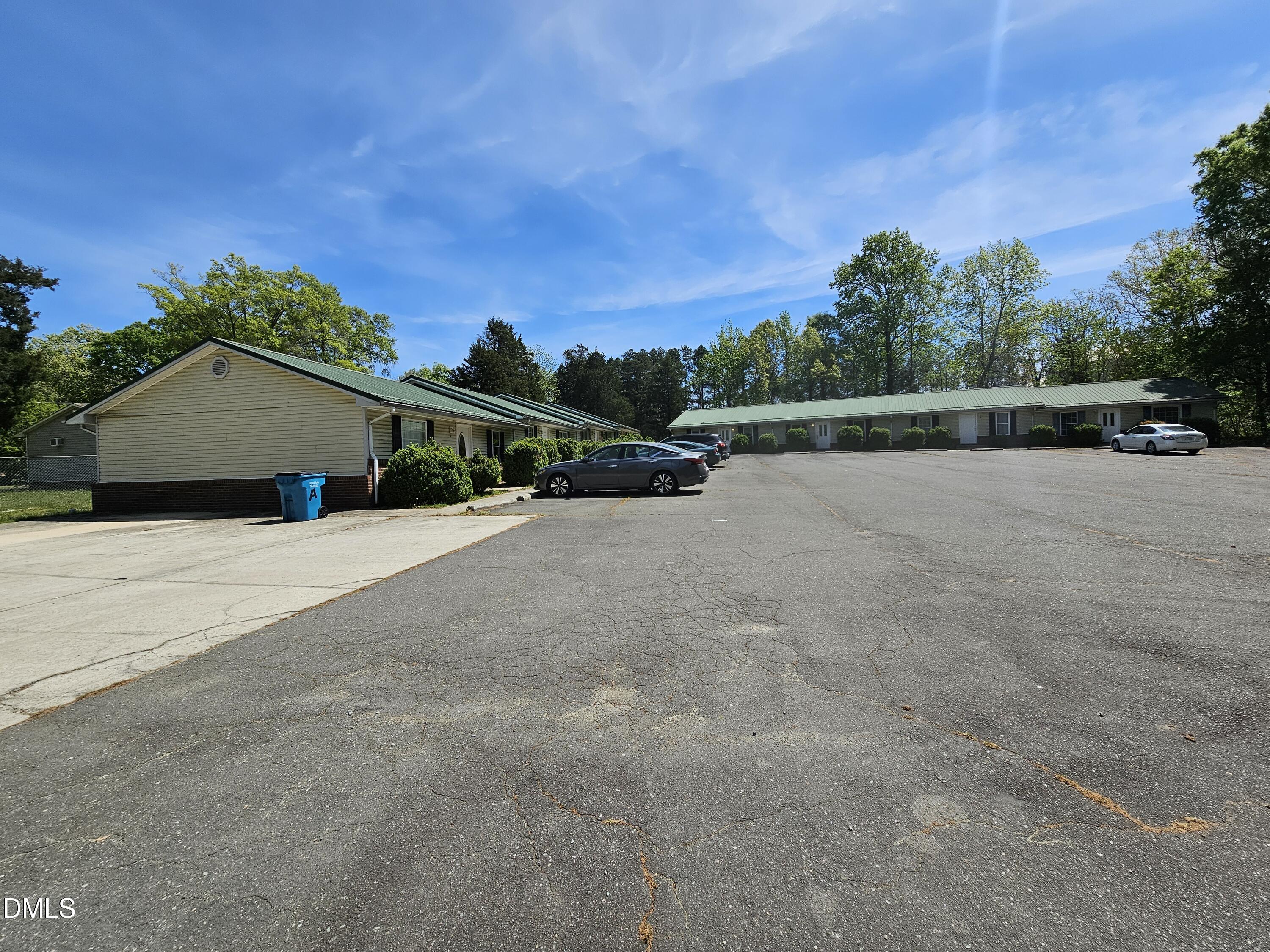 119 Lynn Drive Roxboro, NC 27573 - Photo 27 of 27 a view of an house with backyard and trees