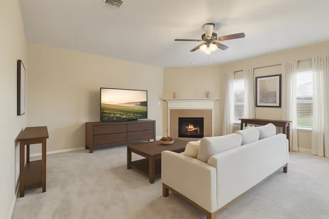 a living room with furniture and a fireplace
