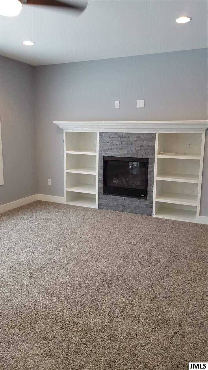 6889 Cambria Drive, Unit 12 Spring Arbor, MI 49283 - Photo 19 of 34 Fireplace with custom built-ins