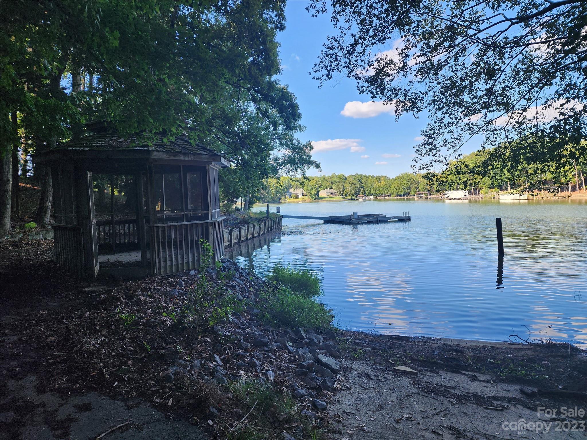 16004 Munson Hill Road Charlotte, NC 28278 - Photo 7 of 12 a view of a lake with large trees