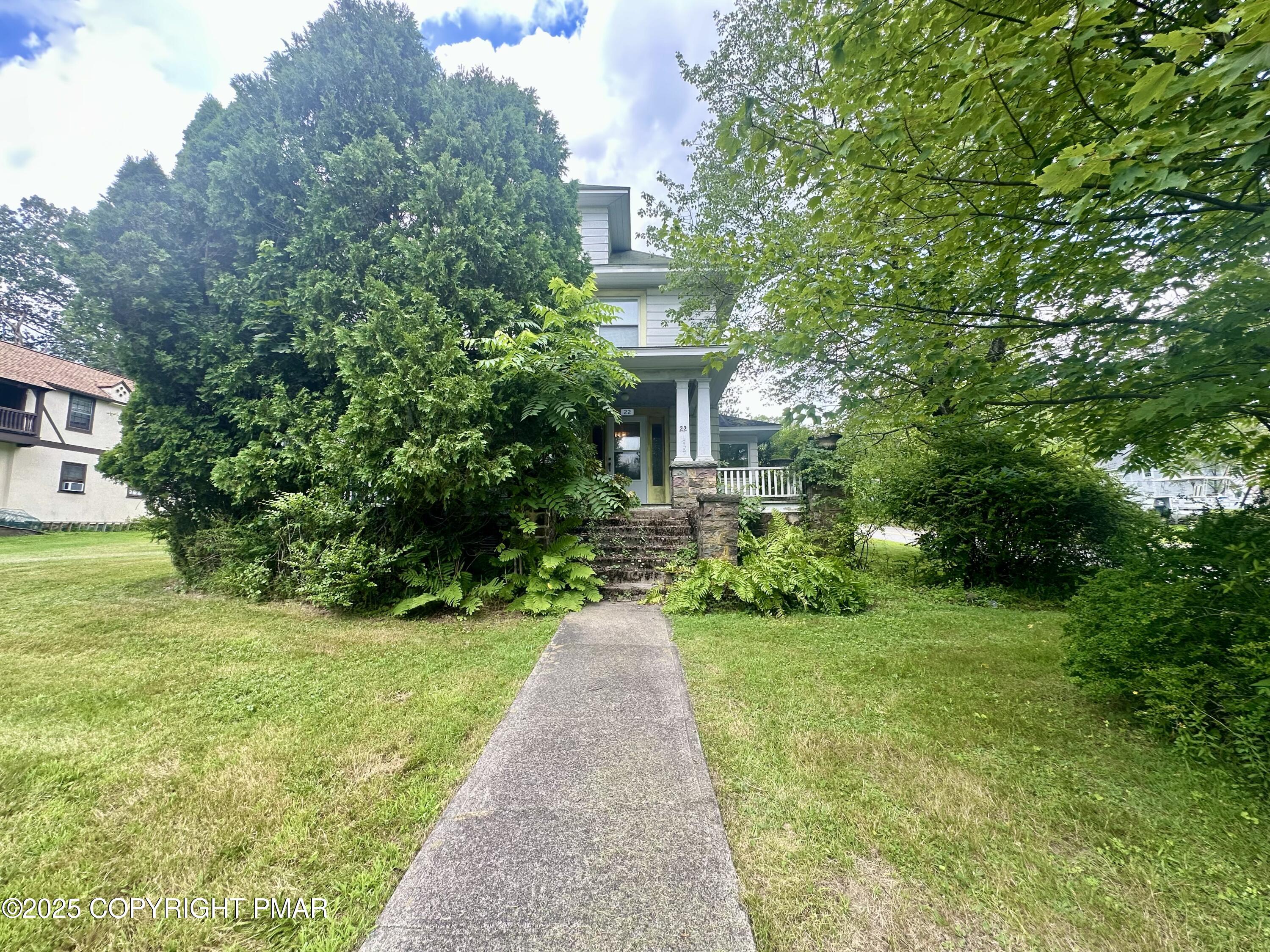 22 Fairview Avenue Mount Pocono, PA 18344 - Photo 2 of 22 a front view of a house with a yard and potted plants