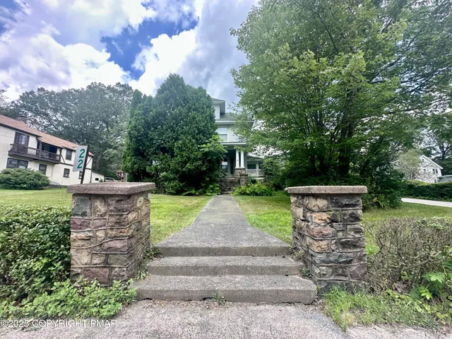 a view of garden with wooden stairs