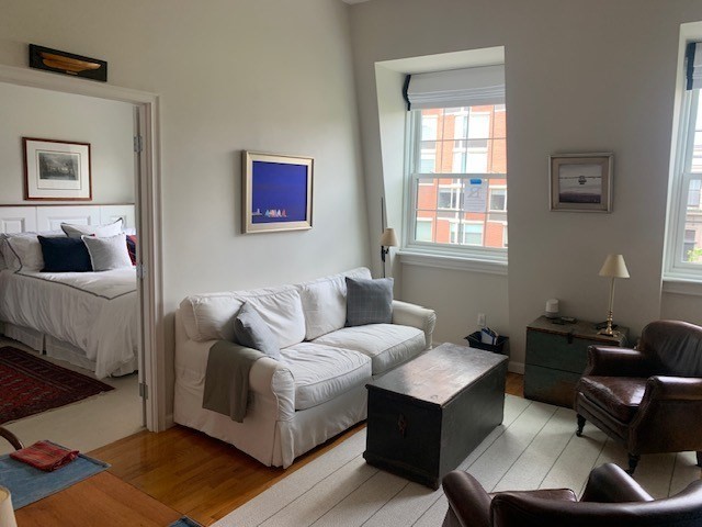 341 Beacon Street, Unit 5A Boston, MA 02116 - Photo 2 of 9 a living room with furniture and a window