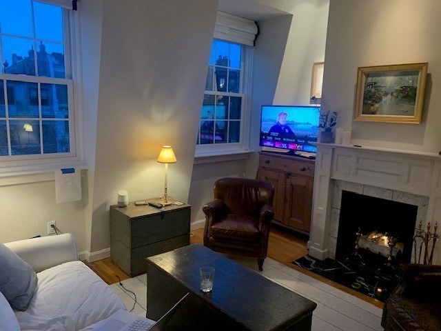 341 Beacon Street, Unit 5A Boston, MA 02116 - Photo 6 of 9 a living room with furniture and a fireplace