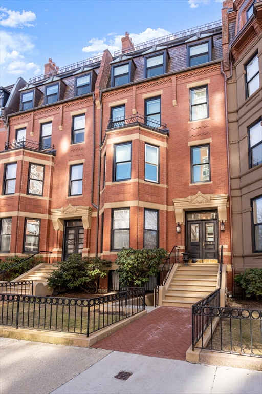 341 Beacon Street, Unit 5A Boston, MA 02116 - Photo 9 of 9 a front view of a building with a garden