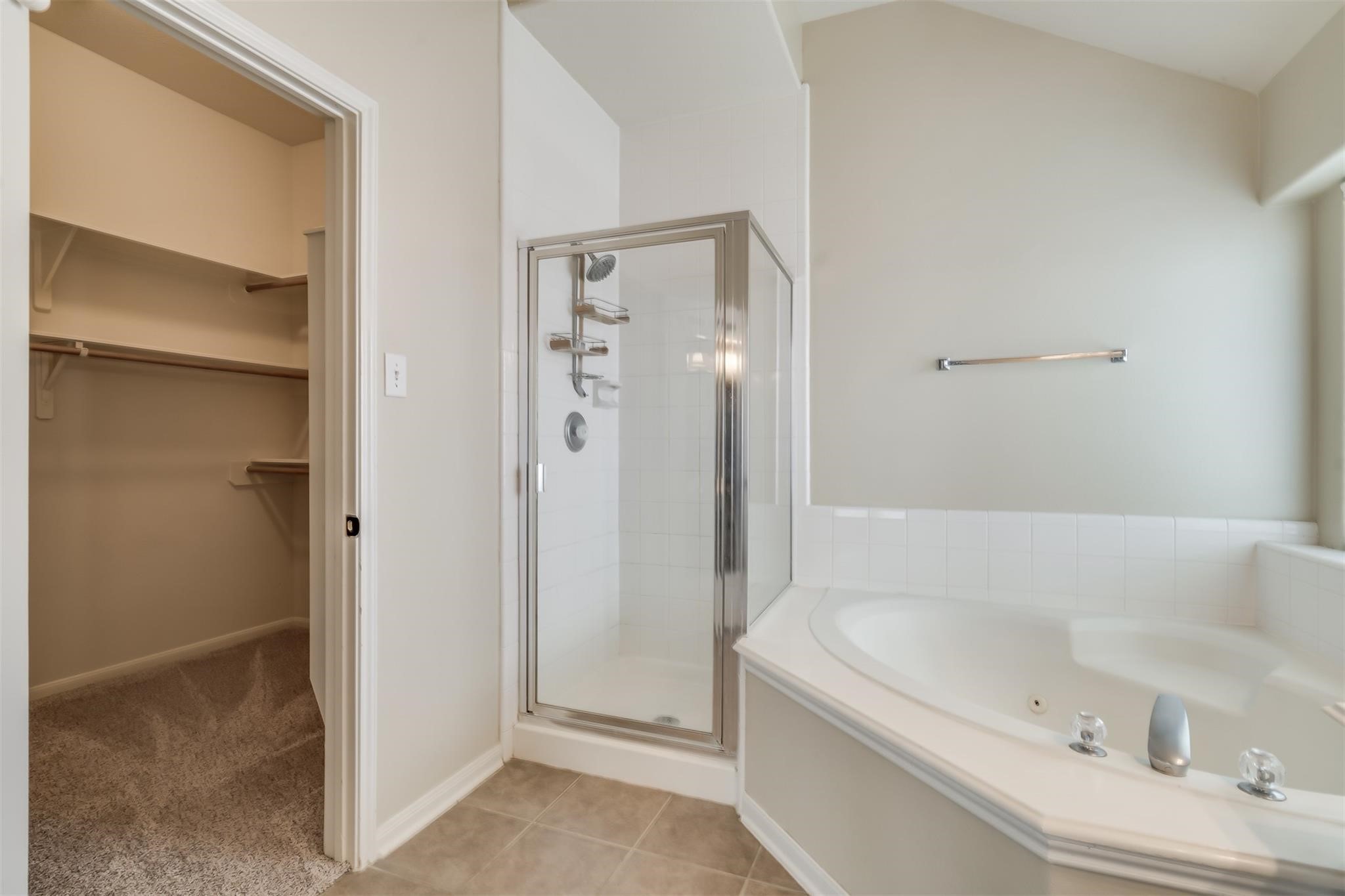 3419 La Fleur Lane Spring, TX 77388 - Photo 17 of 26 a bathroom with a bathtub and a shower