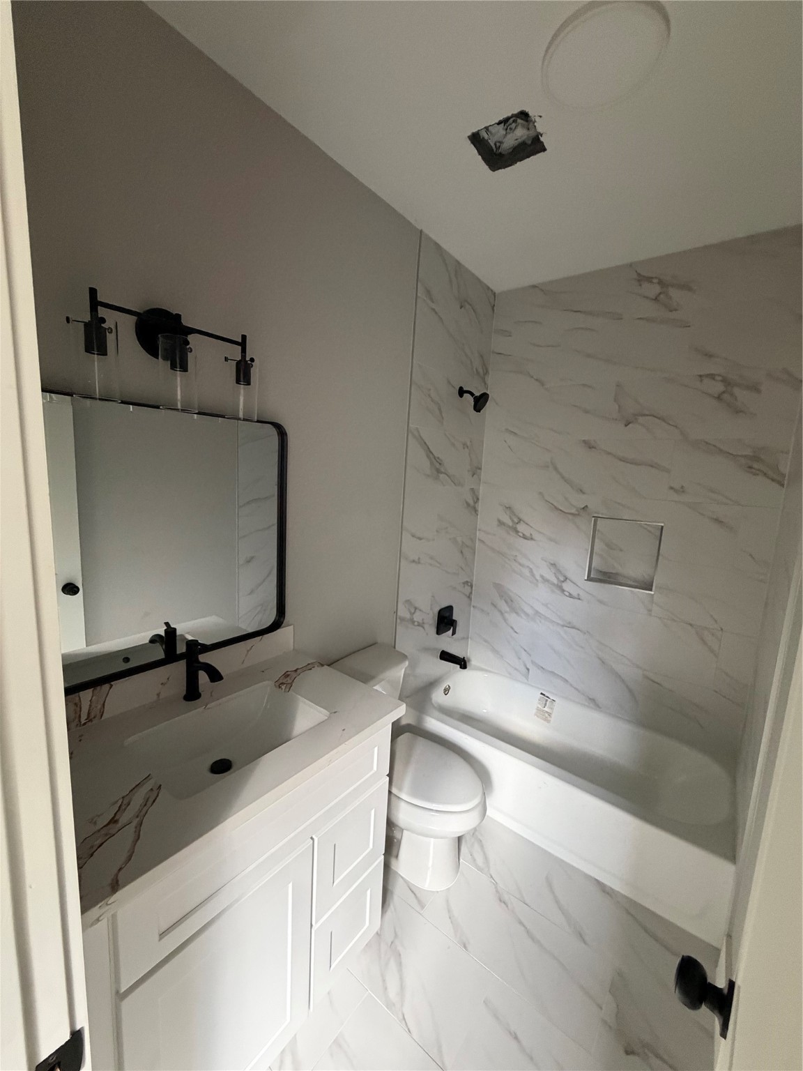 9914 Fillmore Street Houston, TX 77029 - Photo 8 of 11 a bathroom with a sink a toilet and shower