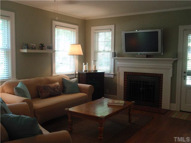 304 Brooks Avenue Raleigh, NC 27607 - Photo 3 of 14 a living room with furniture and a flat screen tv