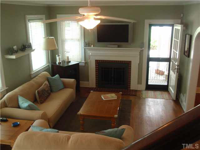 304 Brooks Avenue Raleigh, NC 27607 - Photo 5 of 14 a living room with furniture fireplace and flat screen tv