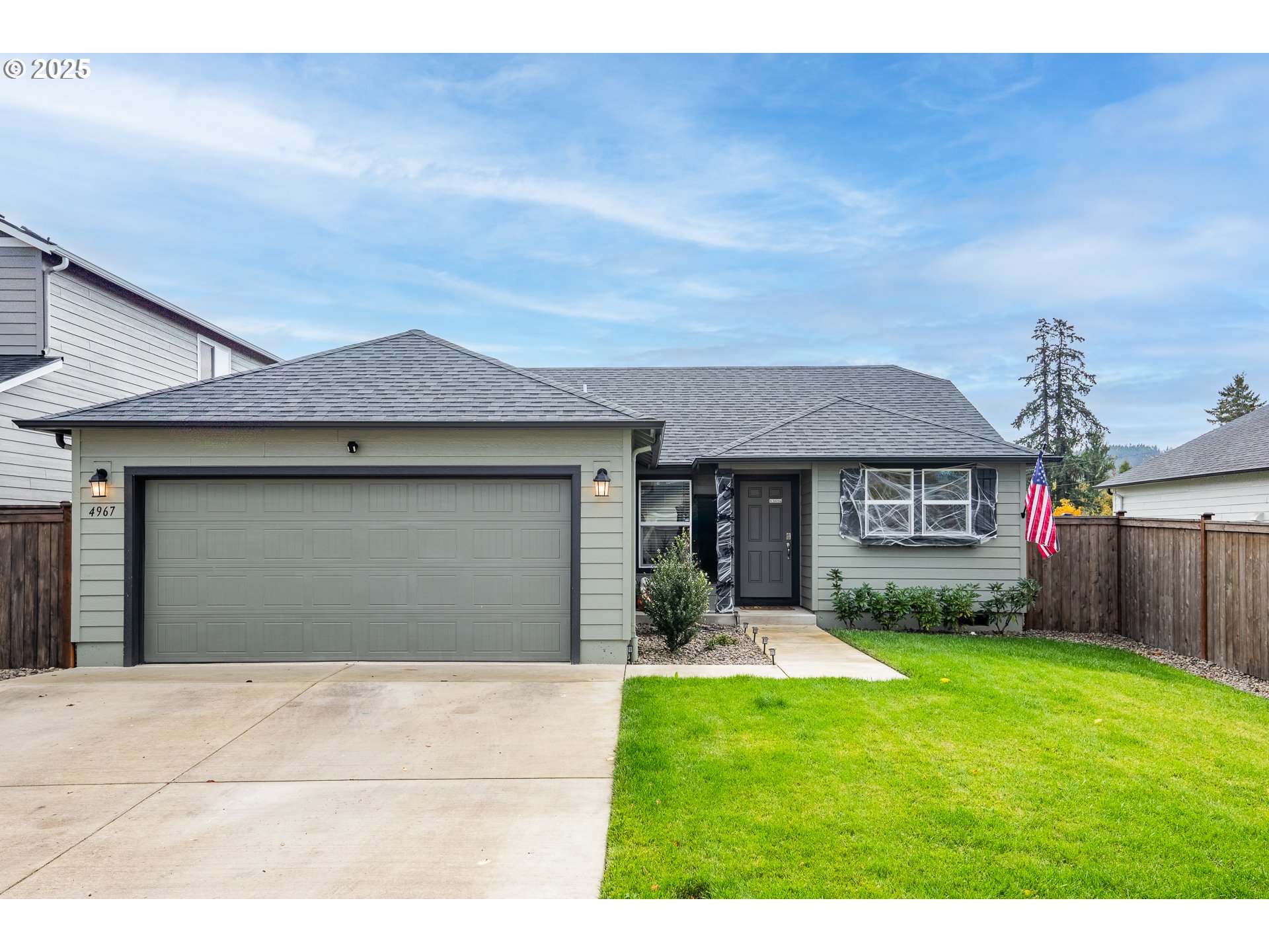 4967 Cedar View Drive Springfield, OR 97478 - Photo 1 of 22 a front view of a house with a yard and garage