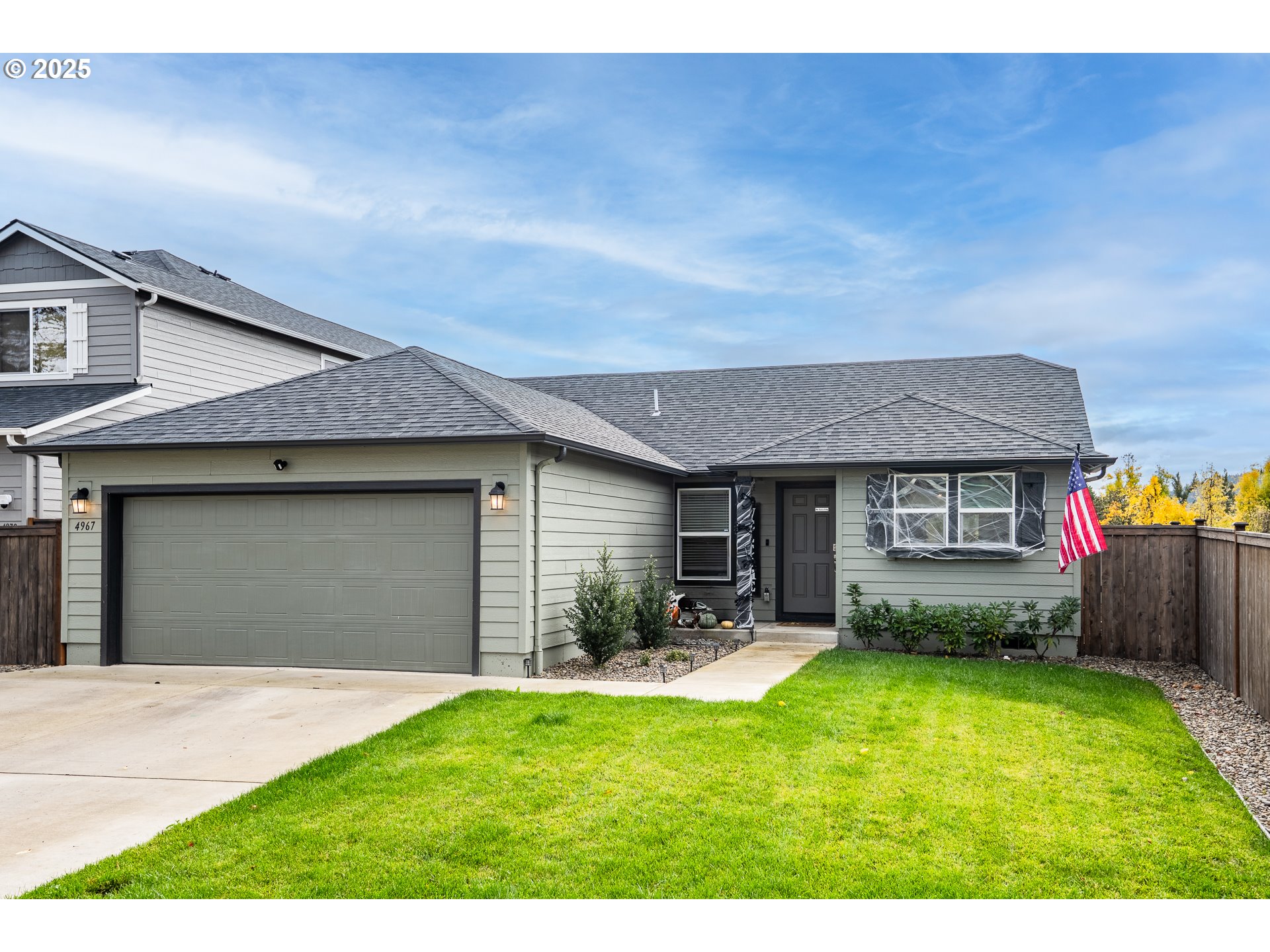 4967 Cedar View Drive Springfield, OR 97478 - Photo 2 of 22 a front view of a house with a yard and garage