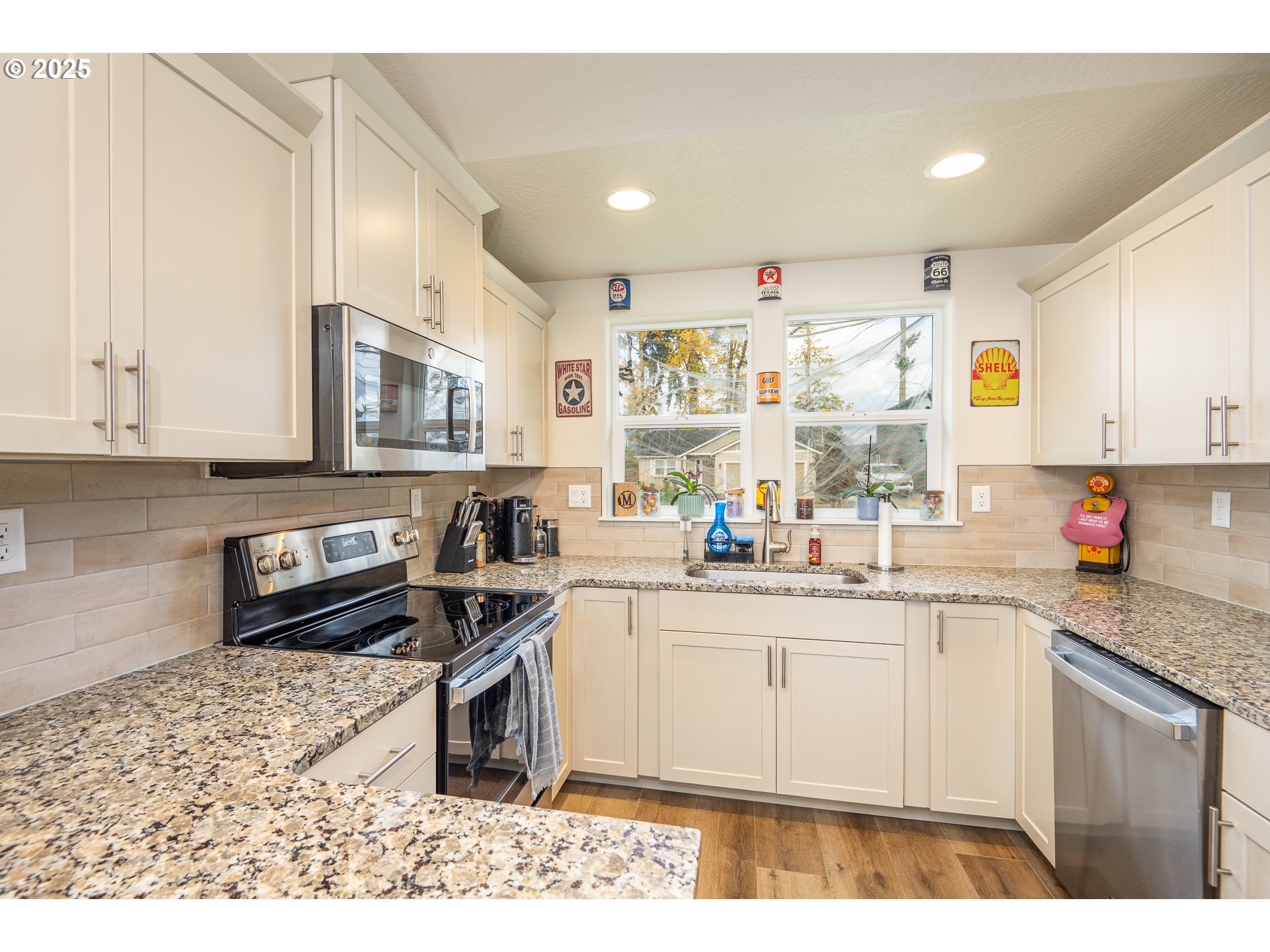 4967 Cedar View Drive Springfield, OR 97478 - Photo 5 of 22 a kitchen with kitchen island granite countertop a sink cabinets and stainless steel appliances