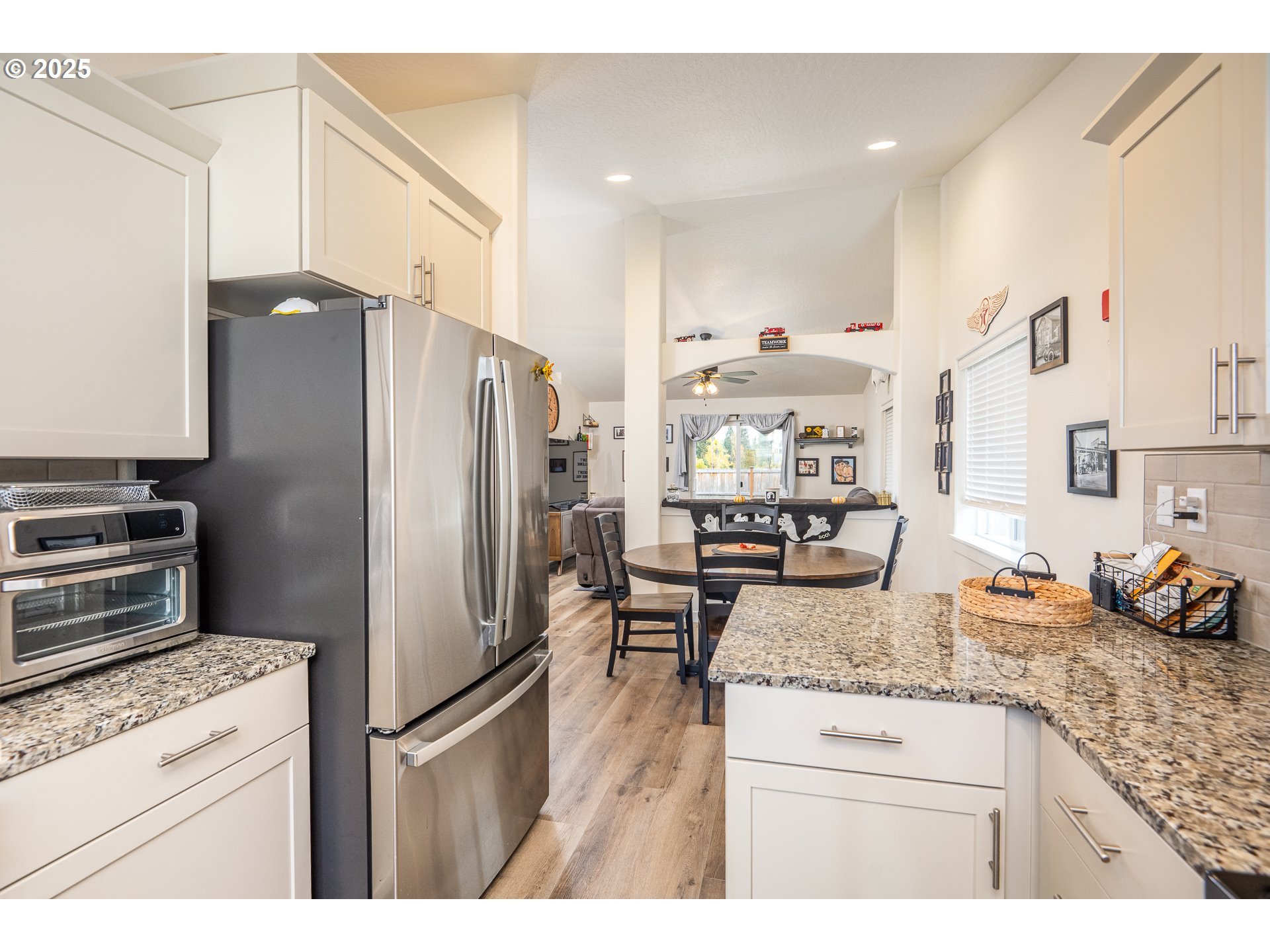 4967 Cedar View Drive Springfield, OR 97478 - Photo 6 of 22 a kitchen with stainless steel appliances granite countertop a refrigerator a stove and a sink
