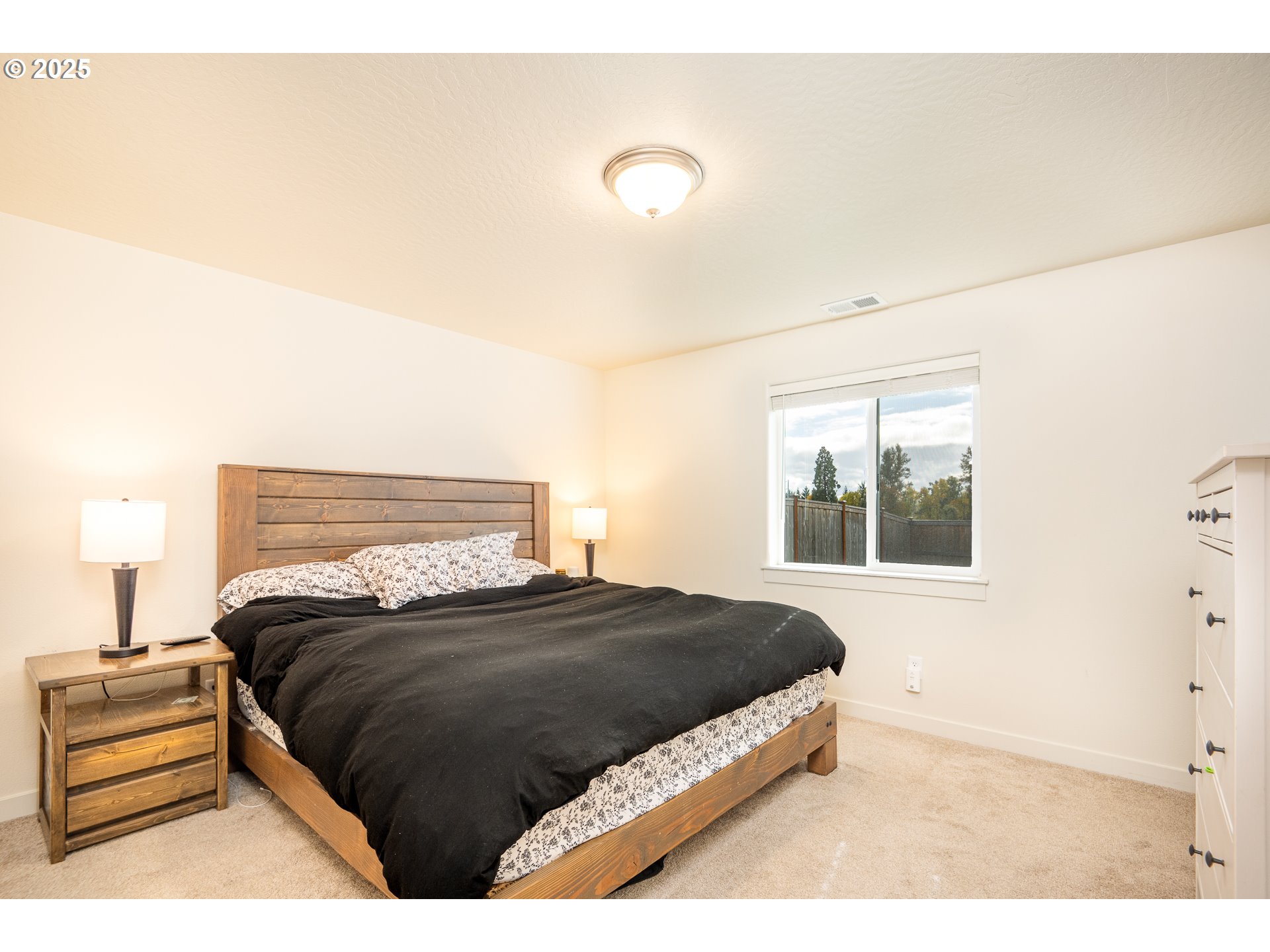 4967 Cedar View Drive Springfield, OR 97478 - Photo 9 of 22 a bedroom with a bed and a night stand