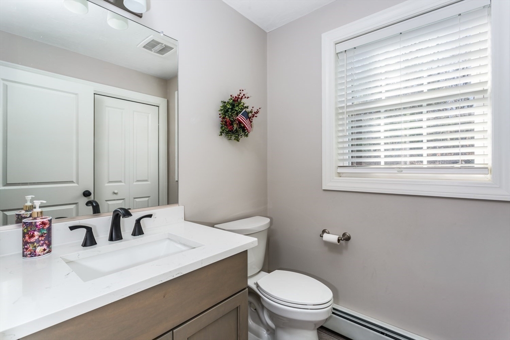 56 Fuller Place Franklin, MA 02038 - Photo 15 of 42 a bathroom with a sink and a toilet