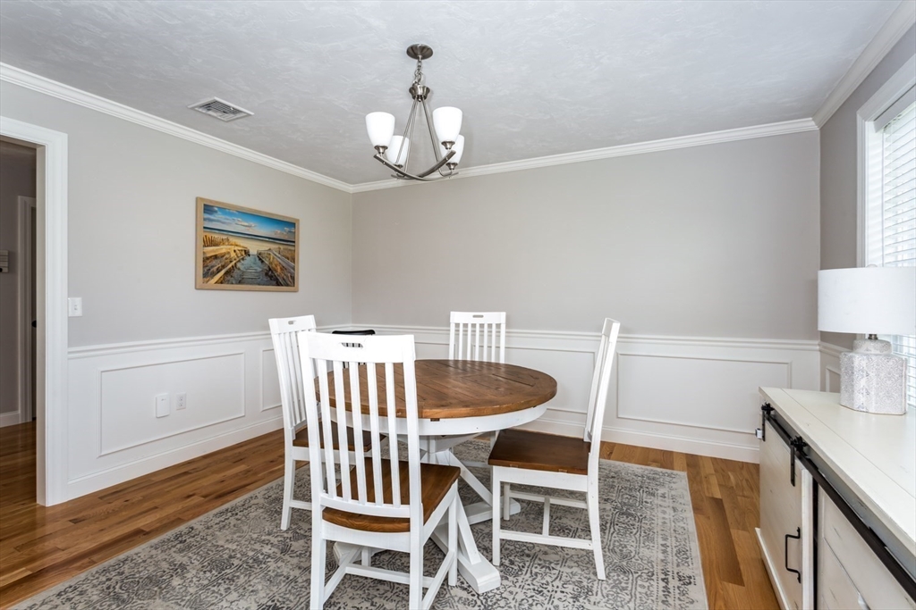 56 Fuller Place Franklin, MA 02038 - Photo 16 of 42 a view of a dining room with furniture and wooden floor