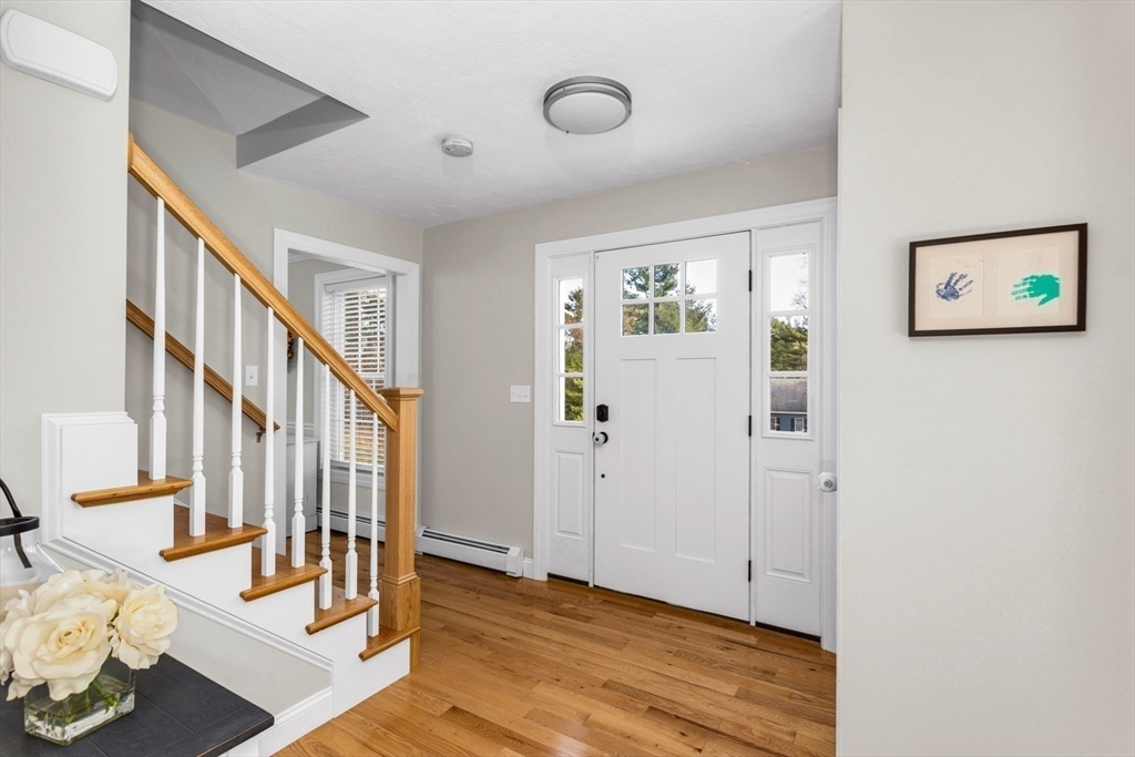 56 Fuller Place Franklin, MA 02038 - Photo 17 of 42 a view of an entryway with wooden floor