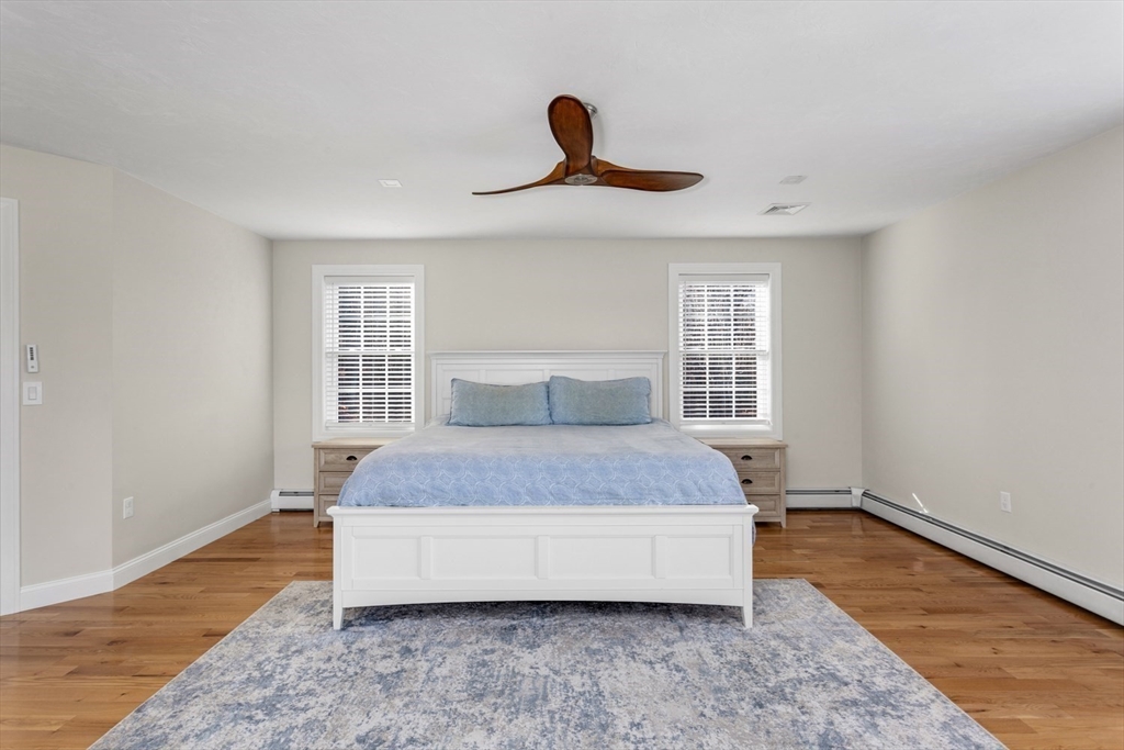 56 Fuller Place Franklin, MA 02038 - Photo 22 of 42 a spacious bedroom with a bed and a window