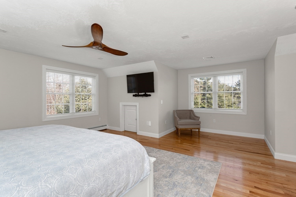 56 Fuller Place Franklin, MA 02038 - Photo 23 of 42 a bedroom with a bed and a flat screen tv