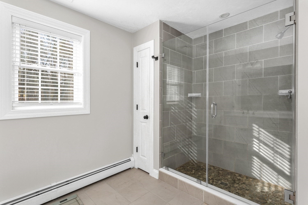 56 Fuller Place Franklin, MA 02038 - Photo 25 of 42 a bathroom with a shower and a sink