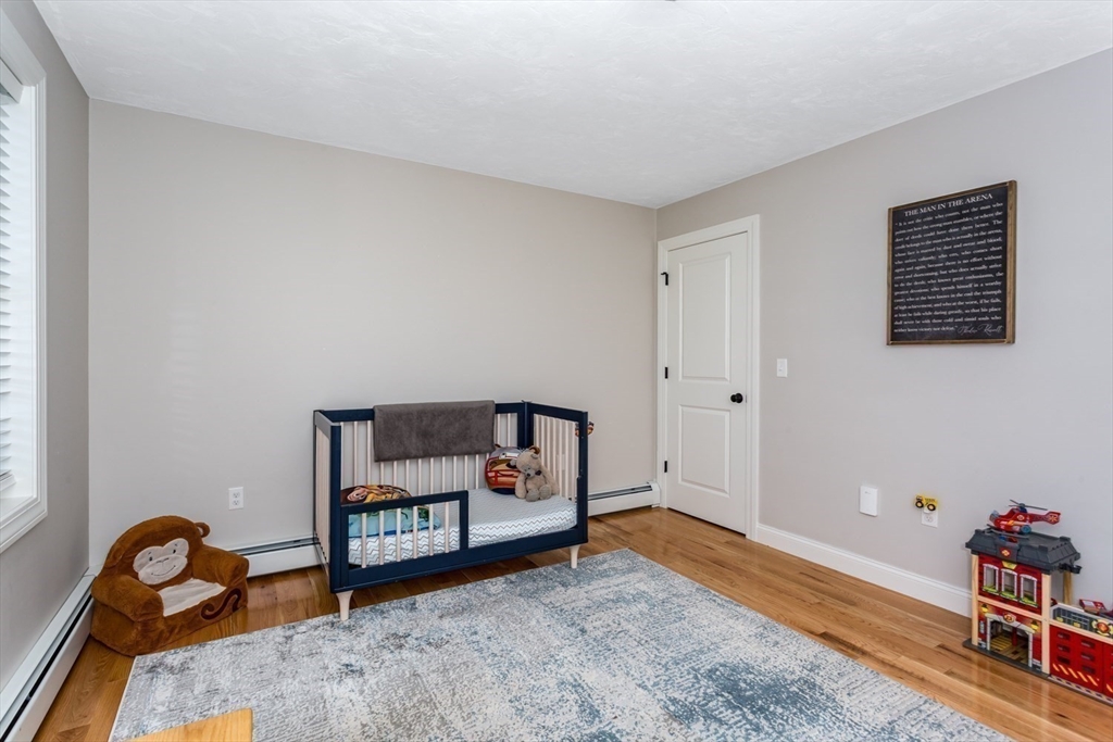 56 Fuller Place Franklin, MA 02038 - Photo 27 of 42 a bedroom with furniture and a window