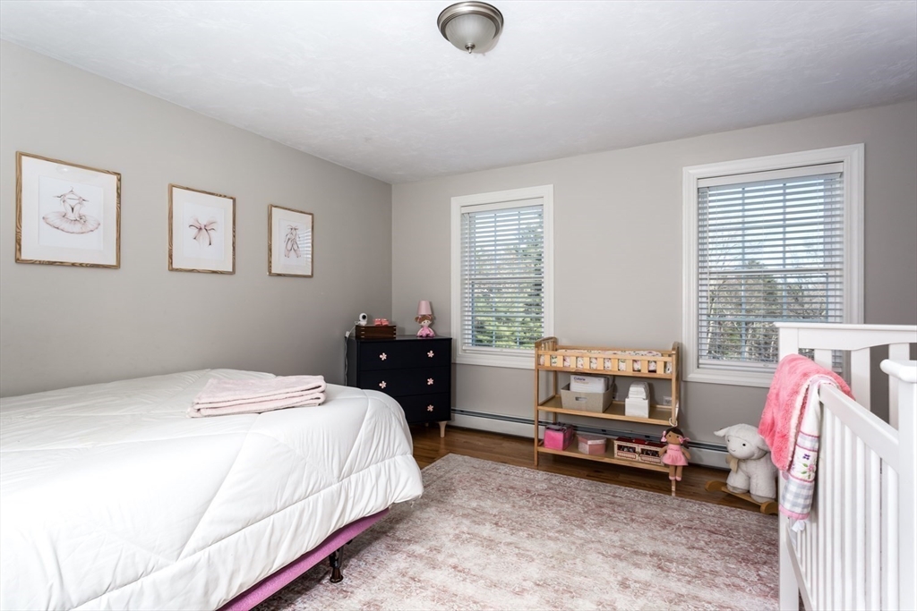 56 Fuller Place Franklin, MA 02038 - Photo 29 of 42 a bedroom with a bed and a couch