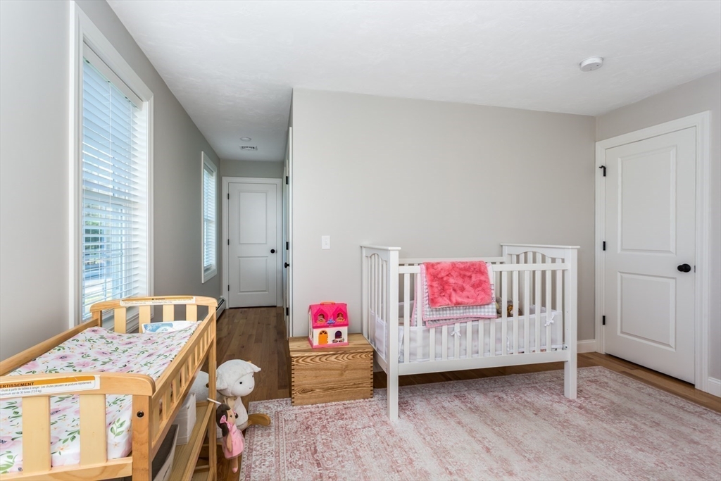 56 Fuller Place Franklin, MA 02038 - Photo 30 of 42 a bedroom with furniture and a window
