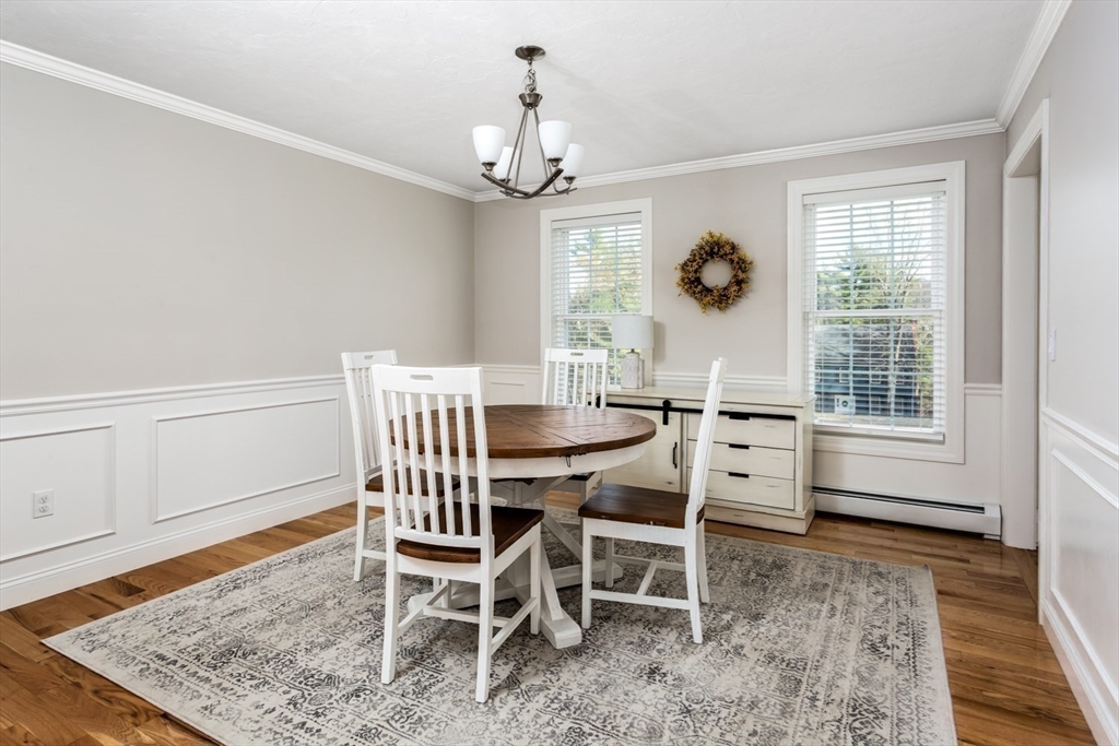 56 Fuller Place Franklin, MA 02038 - Photo 3 of 42 a view of a dining room with furniture window and wooden floor