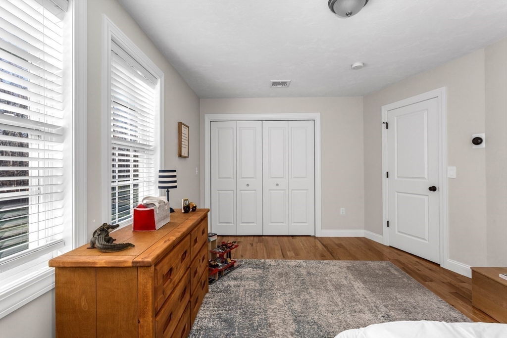 56 Fuller Place Franklin, MA 02038 - Photo 32 of 42 a bedroom with a bed and a window