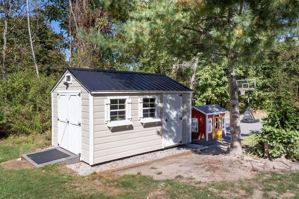 56 Fuller Place Franklin, MA 02038 - Photo 36 of 42 a view of a house with a yard