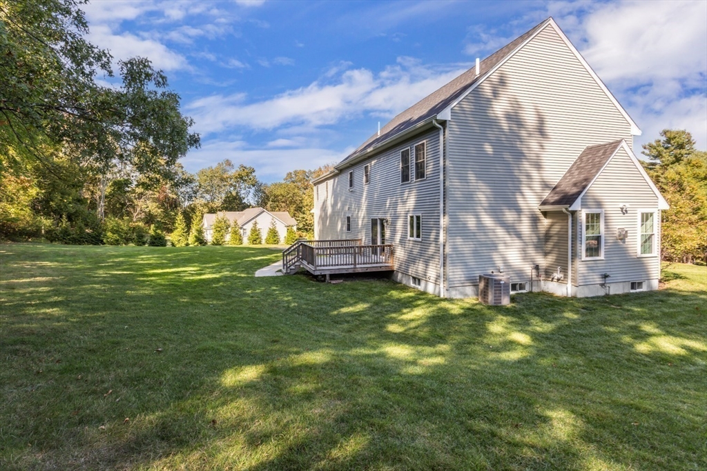 56 Fuller Place Franklin, MA 02038 - Photo 39 of 42 a view of a house with a yard