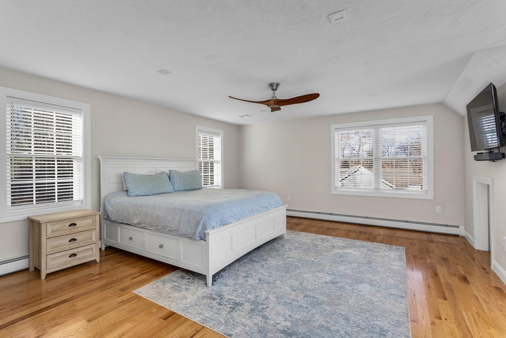 56 Fuller Place Franklin, MA 02038 - Photo 5 of 42 a bedroom with a large bed and a tv