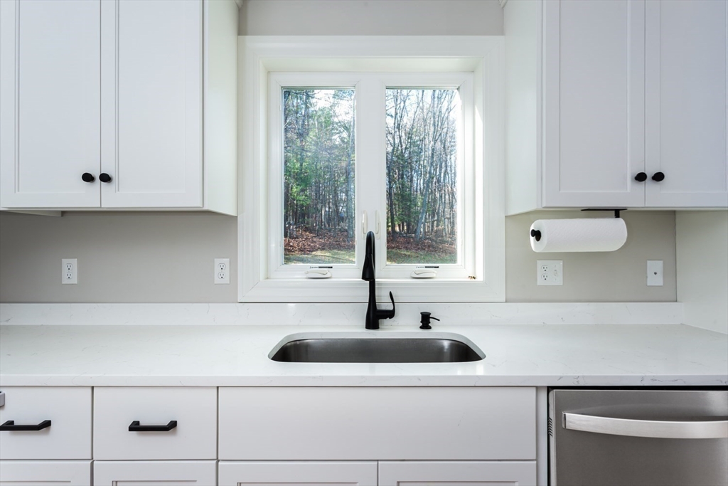 56 Fuller Place Franklin, MA 02038 - Photo 10 of 42 a kitchen with a sink and a window