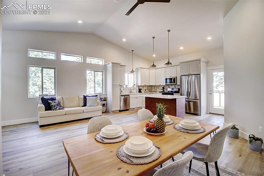 196 Shannon Place Divide, CO 80814 - Photo 11 of 25 a view of a dining room with furniture and wooden floor