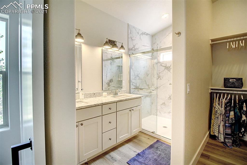 196 Shannon Place Divide, CO 80814 - Photo 12 of 25 a bathroom with a granite countertop sink and a mirror