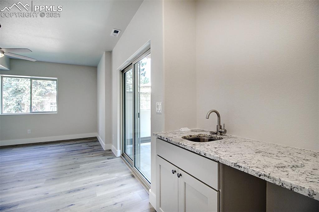 196 Shannon Place Divide, CO 80814 - Photo 19 of 25 a bathroom with a granite countertop sink and a window