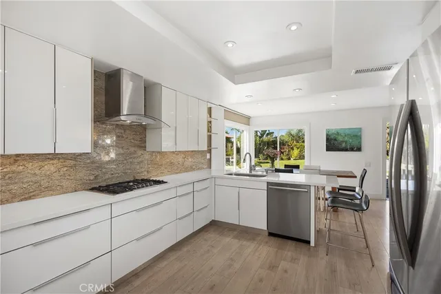 a kitchen with a sink and wooden cabinets