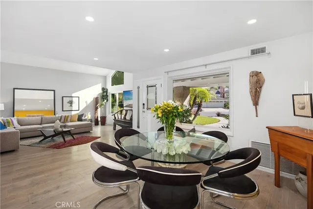 a living room with furniture and a dining room
