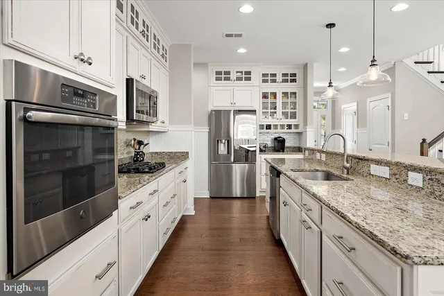 a living room with furniture and flat screen tv