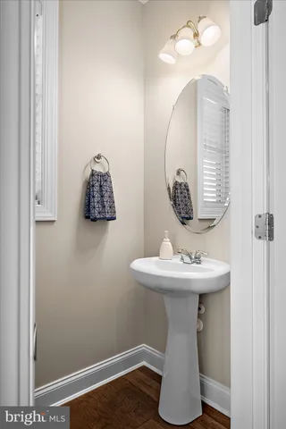 a bathroom with a double vanity sink a toilet and a shower